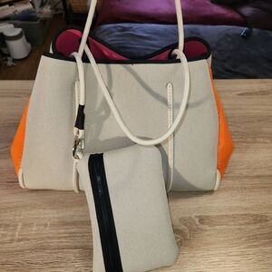 Haute Shore Greyson Riot Neoprene Tote Bag with a matching zippered wristlet pou